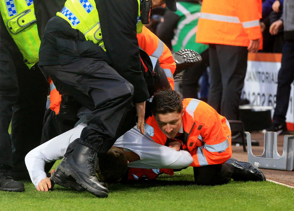 Arrests made after pitch invasions at Bournemouth and Swansea
