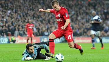 Wigan reach FA Cup final as Millwall fans fight